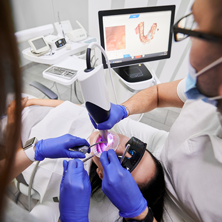 Dentist capturing close-up photos of a patient's teeth