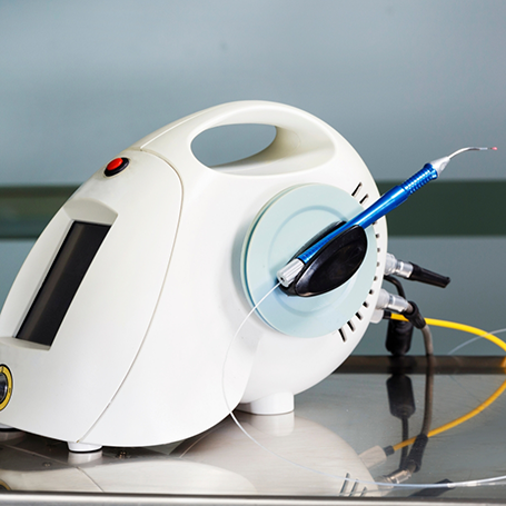 Pen-like dental laser device attached to a dock