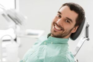 Man smiling at his dental appointment