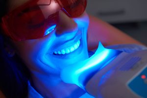 Ultraviolet light applied to patient's in-office teeth whitening